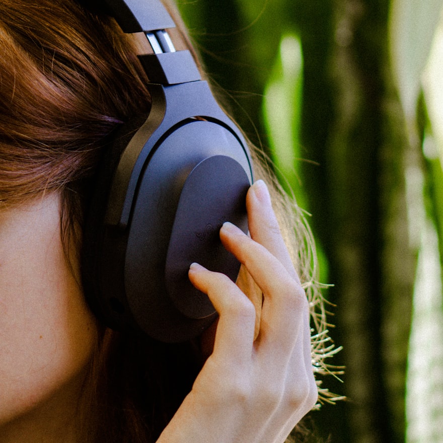Lifestyle image of person enjoying music with earbuds